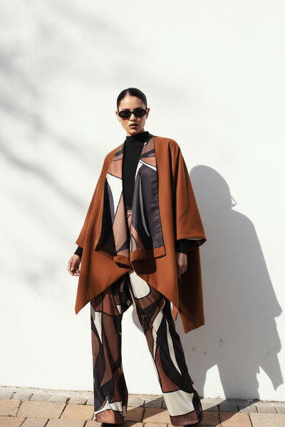 woman in brown poncho