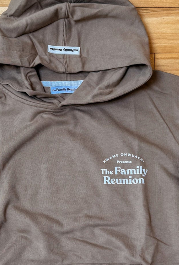 Brown hoodie with a logo on a wooden floor